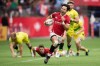 Canada's Nathan Hirayama, front, runs the ball towards the try zone before passing to Harry Jones who scored, during a semifinal match against Australia at the Canada Sevens rugby tournament in Vancouver, on Sunday, March 8, 2020.&nbsp;The wait is finally over for co-captain Hirayama and the Canadian men's rugby sevens team. THE CANADIAN PRESS/Darryl Dyck