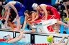 Canada's Rebecca Smith,, Kayla Sanchez, Margaret MacNeil and Penny Oleksiak celebrate a silver medal in the women's 4 x 100m freestyle relay during the Tokyo Olympics in Tokyo, Japan on Sunday, July 25, 2021. THE CANADIAN PRESS/Frank Gunn