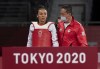 Skylar Park, from Winnipeg, Man., walks with her coach and father Jae Park after losing to Taiwan’s Chia-Ling Lo in the Women’s 57Kg Taekwondo quarter-final at the Tokyo Olympics, Sunday, July 25, 2021 in Chiba, Japan. THE CANADIAN PRESS/Adrian Wyld