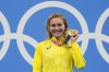 Ariarne Titmus, of Australia holds up her medal after winning the final of the women's 400-meters freestyle at the 2020 Summer Olympics, Monday, July 26, 2021, in Tokyo, Japan. (AP Photo/Matthias Schrader)