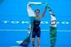 Flora Duffy of Bermuda celebrates after crossing the finish line to win the gold medal in the women's individual triathlon competition at the 2020 Summer Olympics, Tuesday, July 27, 2021, in Tokyo, Japan. (AP Photo/David Goldman)