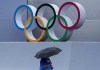 A venue official takes a look at the BMX Freestyle course after a training session was cancelled due to rain, at the 2020 Summer Olympics, Tuesday, July 27, 2021, in Tokyo, Japan. (AP Photo/Ben Curtis)