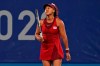 Naomi Osaka, of Japan, reacts after losing a point to Marketa Vondrousova, of the Czech Republic, during the third round of the tennis competition at the 2020 Summer Olympics, Tuesday, July 27, 2021, in Tokyo, Japan. (AP Photo/Seth Wenig)