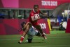 Canada's Keyara Wardley (12) attempts to break a tackle by Brazil's Thalita da Silva Costa (12) during preliminary-round rugby action during the Tokyo Summer Olympic Games Thursday, July 29, 2021. THE CANADIAN PRESS/HO, COC, Leah Hennel *MANDATORY CREDIT*
