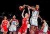 Japan's Saori Miyazaki (32), center, is blocked by United States' Brittney Griner (15), second right, during women's basketball preliminary round game at the 2020 Summer Olympics, Friday, July 30, 2021, in Saitama, Japan. (AP Photo/Eric Gay)