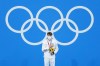 Robert Finke, of the United States, receives his gold medal in the men's 1500-meter freestyle final at the 2020 Summer Olympics, Sunday, Aug. 1, 2021, in Tokyo, Japan. (AP Photo/Jeff Roberson)