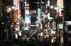 FILE - In this July 16, 2021, file photo, people crowd the street in the Kabukicho area, Tokyo's entertainment district. Japan is now in its fourth state of emergency. Restaurants and bars are asked to close early and can’t serve alcohol. (AP Photo/Jae C. Hong, File)