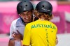 Keegan Palmer of Australia, right, embraces Cory Juneau of the United States during the men's park skateboarding finals at the 2020 Summer Olympics, Thursday, Aug. 5, 2021, in Tokyo, Japan. (AP Photo/Ben Curtis)