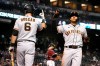 San Francisco Giants' Donovan Solano celebrates with Steven Duggar (6) after hitting a solo home run against the Arizona Diamondbacks during the fourth inning of a baseball game Wednesday, Aug. 4, 2021, in Phoenix. (AP Photo/Rick Scuteri)