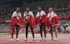 Memebrs of Canada's 4 X100-metre relay team celebrate their bronze medal win during the Tokyo Olympics in Tokyo, Japan on Friday, Aug.6, 2021. THE CANADIAN PRESS/Nathan Denette