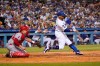 Los Angeles Dodgers' Mookie Betts drives in a run with a single during the fourth inning of the team's baseball game against the Los Angeles Angels on Friday, Aug. 6, 2021, in Los Angeles. (AP Photo/Marcio Jose Sanchez)