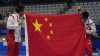 Cao Yuan of China, left, gold medal and Yang Jian of China, silver medal kiss their flag after men's diving 10m platform final at the Tokyo Aquatics Centre at the 2020 Summer Olympics, Saturday, Aug. 7, 2021, in Tokyo, Japan. (AP Photo/Dmitri Lovetsky)