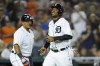 Detroit Tigers' Jonathan Schoop, right, scores on a Robbie Grossman single in the seventh inning of a baseball game against the Boston Red Sox in Detroit, Tuesday, Aug. 3, 2021. (AP Photo/Paul Sancya)