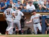 San Francisco Giants' Brandon Belt (9) receives congratulations after his two-run home run against the Milwaukee Brewers during the seventh inning of a baseball game Sunday, Aug. 8, 2021, in Milwaukee. (AP Photo/Jeffrey Phelps)