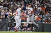 Minnesota Twins' Jorge Polanco, right, celebrates his three-run home run with third base coach Tony Diaz during the sixth inning of a baseball game against the Houston Astros, Sunday, Aug. 8, 2021, in Houston. (AP Photo/Eric Christian Smith)