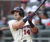 Atlanta Braves outfielder Adam Duvall hits a 2-RBI home run against the Washington Nationals during the sixth inning in a baseball game on Sunday, August 8, 2021, in Atlanta. (Curtis Compton/Atlanta Journal-Constitution via AP)