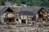 FILE - This Thursday, July 15, 2021 file photo shows destroyed houses in Schuld, Germany. Due to heavy rains, the Ahr River dramatically flooded over its banks the previous evening. (AP Photo/Michael Probst)