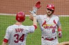 St. Louis Cardinals' Paul DeJong (11) is greeted by starting pitcher J.A. Happ (34) after hitting a solo home run against the Pittsburgh Pirates during the second inning of a baseball game Tuesday, Aug. 10, 2021, in Pittsburgh. (AP Photo/Keith Srakocic)