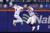 New York Mets' Albert Almora Jr. (4) and Brandon Nimmo (9) celebrate after the Mets defeated the Washington Nationals in the completion of a suspended baseball game Wednesday, Aug. 11, 2021, in New York. The Mets won 8-7. (AP Photo/Mary Altaffer)