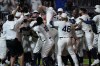 Chicago White Sox's Tim Anderson celebrates his walk-off home run against the New York Yankees in the ninth inning during a baseball game, Thursday, Aug. 12, 2021 in Dyersville, Iowa. The Yankees and White Sox are playing at a temporary stadium in the middle of a cornfield at the Field of Dreams movie site, the first Major League Baseball game held in Iowa. The White Sox won 9-8. (AP Photo/Charlie Neibergall)