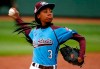 FILE - In this Aug. 15, 2014, file photo, Pennsylvania's Mo'ne Davis delivers in the fifth inning against Tennessee during a baseball game at the Little League World Series tournament in South Williamsport, Pa. ESPN will be using young commentators and sideline reporters as part of the Little League World Series in Williamsport, Pennsylvania. Mo’ne Davis, the celebrated pitcher for Pennsylvania in the Little League World Series in 2014, will be an analyst for the second time. (AP Photo/Gene J. Puskar, File)