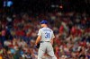 Los Angeles Dodgers starting pitcher Max Scherzer stands in the rain during the fourth inning of a baseball game against the Philadelphia Phillies, Tuesday, Aug. 10, 2021, in Philadelphia. (AP Photo/Matt Slocum)