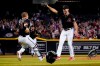 Arizona Diamondbacks starting pitcher Tyler Gilbert, right, celebrates after his no-hitter in a baseball game against the San Diego Padres with catcher Daulton Varsho, Saturday, Aug. 14, 2021, in Phoenix. It was Gilbert's first career start. The Diamondbacks won 7-0. (AP Photo/Matt York)