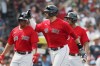 Boston Red Sox's J.D. Martinez, center, celebrates his three-run home run that also drove in Rafael Devers, left, and Xander Bogaerts, right, during the first inning of a baseball game against the Baltimore Orioles, Sunday, Aug. 15, 2021, in Boston. (AP Photo/Michael Dwyer)