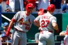 St. Louis Cardinals' Lars Nootbaar (68) congratulates Tyler O'Neill (27) after hitting a home run during the second inning of a baseball game against the Kansas City Royals at Kauffman Stadium in Kansas City, Mo., Sunday, Aug. 15, 2021. (AP Photo/Colin E. Braley)