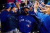 Toronto Blue Jays' Teoscar Hernandez celebrates his three-run home run with teammates in the dugout during the fifth inning of a baseball game against the Los Angeles Angels on August 11, 2021, in Anaheim, Calif. THE CANADIAN PRESS/AP, Marcio Jose Sanchez