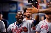 Atlanta Braves' Guillermo Heredia celebrates after scoring on a single by Ozzie Albies during the fourth inning of a baseball game against the Miami Marlins, Monday, Aug. 16, 2021, in Miami. (AP Photo/Wilfredo Lee)