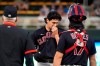 Cleveland Indians pitcher Cal Quantrill, center, gets a mound visit in the third inning of a baseball game against the Minnesota Twins, Monday, Aug. 16, 2021, in Minneapolis. (AP Photo/Jim Mone)