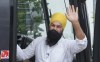 NDP Leader Jagmeet Singh waves as he boards his campaign bus in Coquitlam, B.C.,, on Tuesday, August 17, 2021. THE CANADIAN PRESS/Paul Chiasson