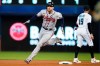 Atlanta Braves' Freddie Freeman rounds second base as he gets a triple during the fourth inning of a baseball game against the Miami Marlins, Wednesday, Aug. 18, 2021, in Miami. (AP Photo/Wilfredo Lee)