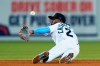 Miami Marlins short stop Jazz Chisholm Jr. tries to pitch back a ball hit by Atlanta Braves' Austin Riley during the fifth inning of a baseball game, Wednesday, Aug. 18, 2021, in Miami. Riley got a base hit. (AP Photo/Wilfredo Lee)