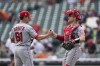 Los Angeles Angels relief pitcher Austin Warren (61) and catcher Max Stassi after the final out in the ninth inning of a baseball game against the Detroit Tigers in Detroit, Thursday, Aug. 19, 2021. The Angels won 13-10. (AP Photo/Paul Sancya)