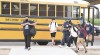 Crane Middle School student get off the bus, Wednesday, July 28, 2021 on the first day of the 2021-2022 school year for all campuses in the Crane School District in Yuma, Ariz. (Randy Hoeft/The Yuma Sun via AP)