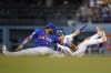 Los Angeles Dodgers' Trea Turner, right, is caught stealing second base by New York Mets shortstop Jonathan Villar (1) during the third inning of a baseball game Thursday, Aug 19, 2021, in Los Angeles. (AP Photo/Ashley Landis)