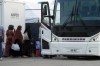 Immigration Minister Marco Mendicino says his department will accelerate the processing of the families of interpreters and others who supported Canada's mission in Afghanistan to evacuate as many approved people as possible quickly. Refugees from Afghanistan and Canadian Citizens board a bus after being processed at Pearson Airport in Toronto, Tuesday, Aug 17, 2021, after arriving indirectly from Afghanistan. THE CANADIAN PRESS/Sean Kilpatrick