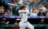 Colorado Rockies' Garrett Hampson watches his two-run home run off Arizona Diamondbacks starting pitcher Tyler Gilbert during the second inning of a baseball game Friday, Aug. 20, 2021, in Denver. (AP Photo/David Zalubowski)