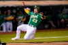 Oakland Athletics' Yan Gomes slides home to score against the San Francisco Giants during the fourth inning of a baseball game in Oakland, Calif., Friday, Aug. 20, 2021. (AP Photo/Jeff Chiu)