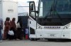 Refugees from Afghanistan and Canadian Citizens board a bus after being processed at Pearson Airport in Toronto, Tuesday, Aug 17, 2021, after arriving indirectly from Afghanistan. Defence Minister Harjit Sajjan says Canada will work tirelessly to evacuate people from strife-ridden Afghanistan 