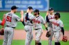 Atlanta Braves' Will Smith (51), Freddie Freeman (5), Dansby Swanson, third from left, Ozzie Albies, right, and others celebrate after a baseball game against the Baltimore Orioles, Sunday, Aug. 22, 2021, in Baltimore. (AP Photo/Nick Wass)