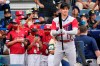 Los Angeles Angels' Shohei Ohtani warms up as Little Leaguers from Hamilton, Ohio, in red, watch before the Little League Classic baseball game against the Cleveland Indians at Bowman Stadium in Williamsport, Pa., Sunday, Aug. 22, 2021. (AP Photo/Tom E. Puskar)