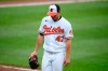 Baltimore Orioles starting pitcher John Means walks back to the dugout after he was pulled from a baseball game during the seventh inning against the Atlanta Braves, Sunday, Aug. 22, 2021, in Baltimore. (AP Photo/Nick Wass)