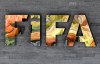 FILE - in this Sept. 25, 2015 file photo, the International Federation of Association Football, FIFA, logo is fixed on a wall of its headquarters during a meeting of the FIFA Executive Committee in Zurich, Switzerland. Reynaldo Vasquez, the former president of the El Salvador Soccer Federation declared himself guilty on Monday, August 23, 2021, before a judge in New York, of money laundering and electronic fraud charges in a corruption scandal that has shaken FIFA since 2015. (AP Photo/Michael Probst, File)