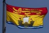 New Brunswick's provincial flag flies on a flagpole in Ottawa, Monday, July 6, 2020. THE CANADIAN PRESS/Adrian Wyld