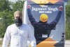 NDP leader Jagmeet Singh walks past his camping bus as he arrives for a news conference in Mississauga, Ont. on Tuesday, August 24, 2021. THE CANADIAN PRESS/Paul Chiasson