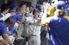 Seattle Mariners' Jarred Kelenic celebrates in the dugout after hitting a solo home run during the sixth inning of a baseball game against the Kansas City Royals, Sunday, Aug. 29, 2021, in Seattle. (AP Photo/Jason Redmond)