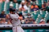 Minnesota Twins designated hitter Josh Donaldson belts a two-run home run during the fourth inning of a baseball game against the Detroit Tigers, Monday, Aug. 30, 2021, in Detroit. (AP Photo/Carlos Osorio)
